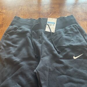Nike womens Black wide leg Sweatpants with White Swoosh